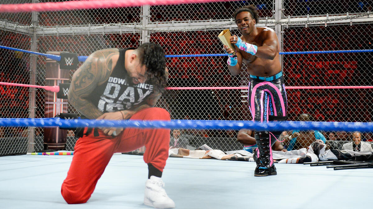 New Day wrestles the Usos inside Hell in a Cell.