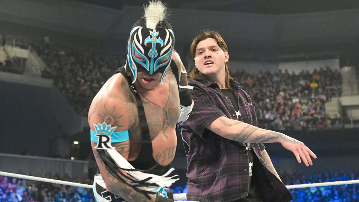 Dominik Mysterio slaps his father Rey Mysterio