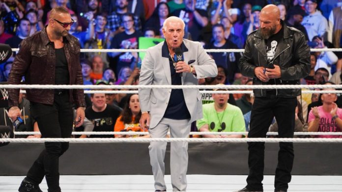 Ric Flair with Batista and Triple H