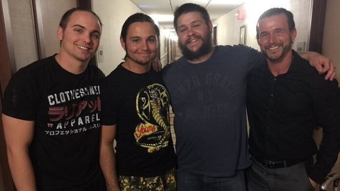 Adam Cole with Kevin Owens and The Young Bucks