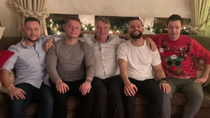 Finn Balor with his father and others