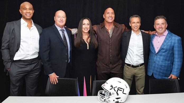 The Rock with other executives